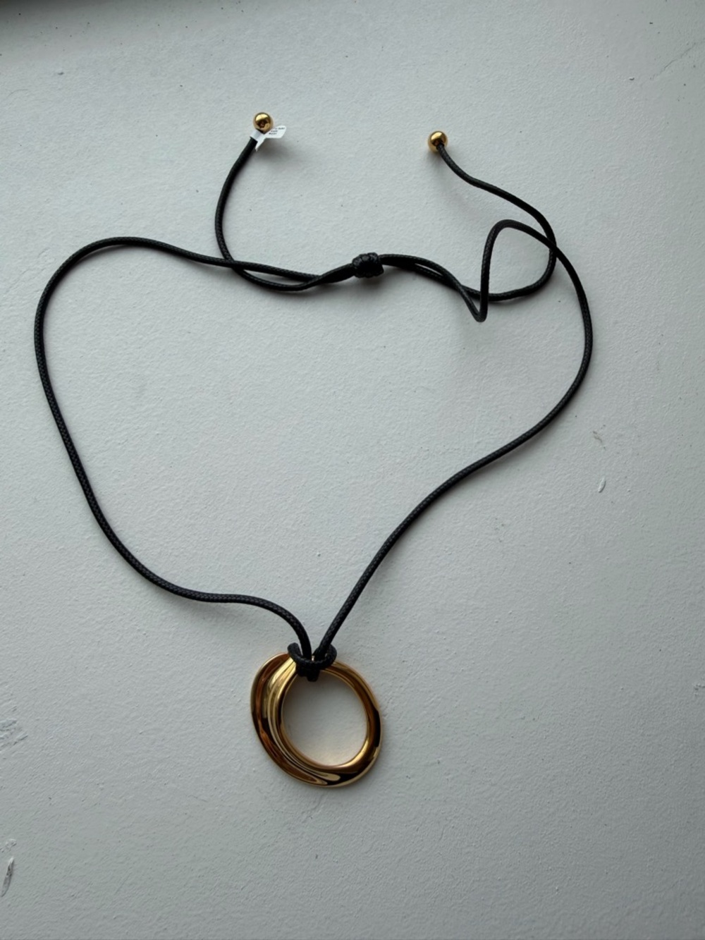 Gold Interlocking Circle Pendant Necklace on Black Cord